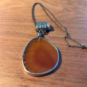 Vintage necklace with amber/orange stone or glass. Practical magic, boho, gems.